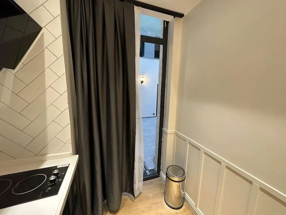Image 2 of THE cozy, below street floor APT